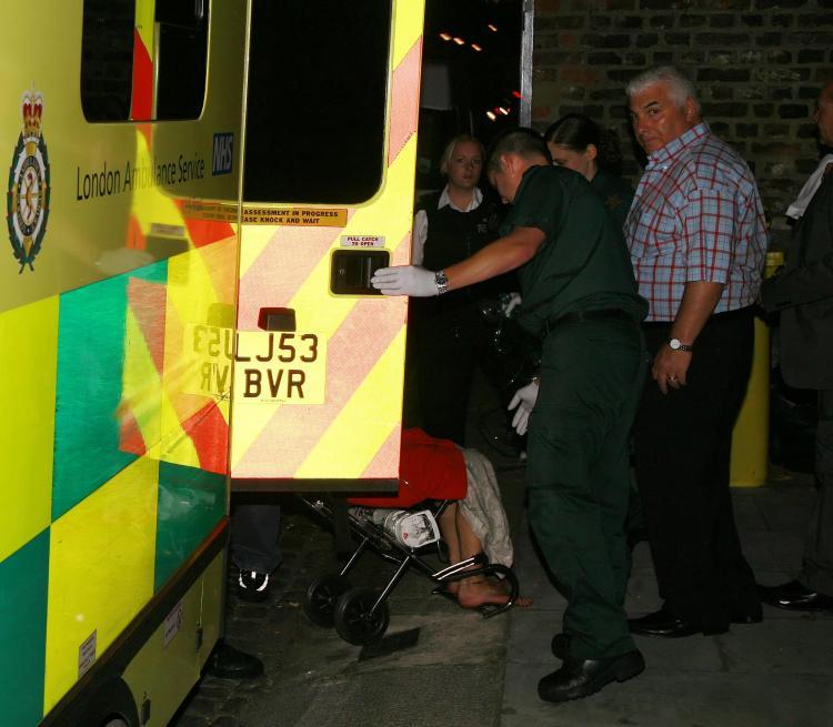<a><img src="https://www.theepochtimes.com/assets/uploads/2015/09/ISOIMAGES_Amy_Winehouse_ambulance_5646.jpg" alt="Amy Winehouse is escorted out of home in a wheelchair by paramedics after a 999 call made by her father, Mitch Winehouse. (ISOIMAGES.COM)" title="Amy Winehouse is escorted out of home in a wheelchair by paramedics after a 999 call made by her father, Mitch Winehouse. (ISOIMAGES.COM)" width="320" class="size-medium wp-image-1834698"/></a>