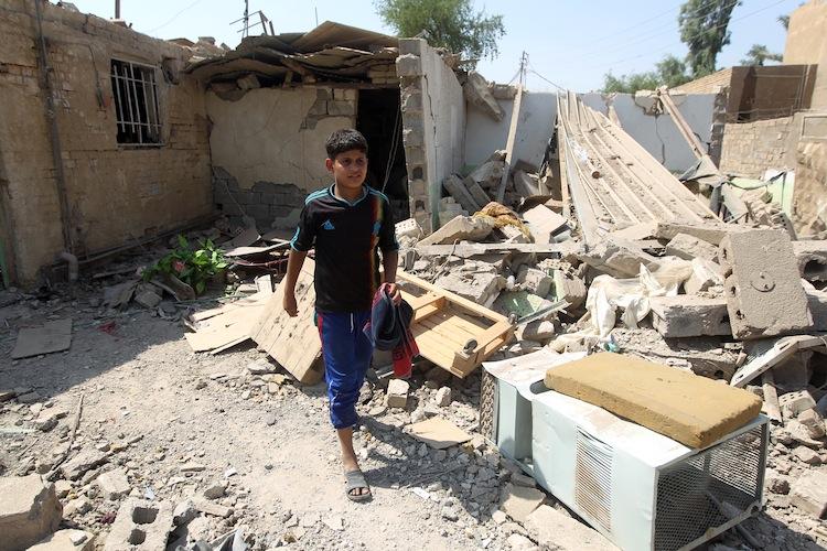 <a><img class="size-full wp-image-1784511" title=" Elven-year-old Mohammad searches for salvageable items amid the rubble of his family's destroyed house following a series of bomb attacks in the town of Taji, north of Baghdad on July 23. (Ahmad Al-RubayeAFP/GettyImages)" src="https://www.theepochtimes.com/assets/uploads/2015/09/Iraq_149129055.jpg" alt="" width="750" height="500"/></a>