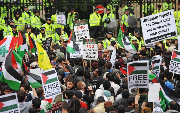 <a><img src="https://www.theepochtimes.com/assets/uploads/2015/09/Israel101302933.jpg" alt="Protesters demonstrate outside the Israeli Embassy in London on May 31, when more than 10 people were killed by Israeli commandos when they stormed a ship which was part of a gaza flotilla of six ships carrying 1,000 tonnes of aid to the Gaza strip.  (Carl De Souza/Getty Images)" title="Protesters demonstrate outside the Israeli Embassy in London on May 31, when more than 10 people were killed by Israeli commandos when they stormed a ship which was part of a gaza flotilla of six ships carrying 1,000 tonnes of aid to the Gaza strip.  (Carl De Souza/Getty Images)" width="320" class="size-medium wp-image-1819233"/></a>