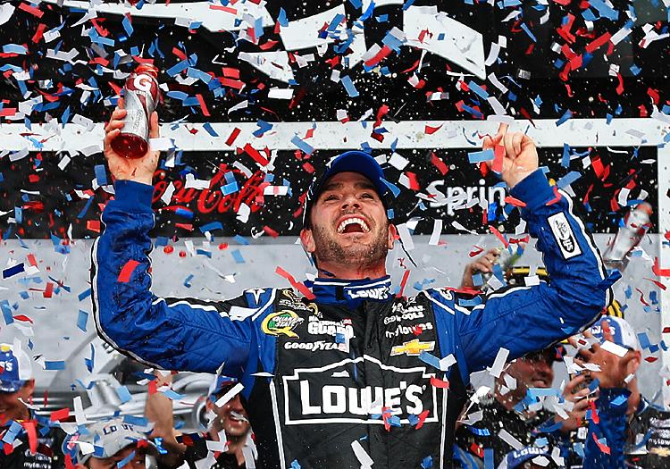 <a><img class="size-full wp-image-1770108" src="https://www.theepochtimes.com/assets/uploads/2015/09/JJWins162531548WEB.jpg" alt="Jimmie Johnson, driver of the #48 Lowe's Chevrolet, celebrates in victory lane after winning the NASCAR Sprint Cup Series Daytona 500 at Daytona International Speedway on February 24, 2013 in Daytona Beach, Florida. (Chris Graythen/Getty Images)" width="750" height="525"/></a>