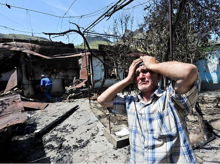 <a><img src="https://www.theepochtimes.com/assets/uploads/2015/09/KYRGYZSTAN102096864WEB.jpg" alt="An ethnic Uzbek holds his head in his hands as he stands beside the wreckage of his burned out home in Osh on June 14, 2010. Deadly gun battles raged in the Kyrgyzstan city of Osh where bodies littered the streets as ethnic violence escalated and Uzbekistan raced to cope with a massive refugee influx. (Victor Drachev/AFP/Getty Images)" title="An ethnic Uzbek holds his head in his hands as he stands beside the wreckage of his burned out home in Osh on June 14, 2010. Deadly gun battles raged in the Kyrgyzstan city of Osh where bodies littered the streets as ethnic violence escalated and Uzbekistan raced to cope with a massive refugee influx. (Victor Drachev/AFP/Getty Images)" width="320" class="size-medium wp-image-1816014"/></a>