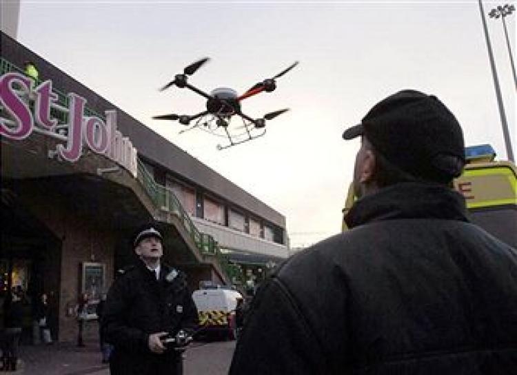 <a><img src="https://www.theepochtimes.com/assets/uploads/2015/09/LPL_POLICE_78603959.jpg" alt="Merseyside police officers in Liverpool use a remote control drone fitted with a TV camera to help combat potential anti-social behaviour during traditional celebrations ahead of the festive period, 21 December 2007, before the CAA rule change.Christopher Furlong/Getty Images" title="Merseyside police officers in Liverpool use a remote control drone fitted with a TV camera to help combat potential anti-social behaviour during traditional celebrations ahead of the festive period, 21 December 2007, before the CAA rule change.Christopher Furlong/Getty Images" width="320" class="size-medium wp-image-1822712"/></a>