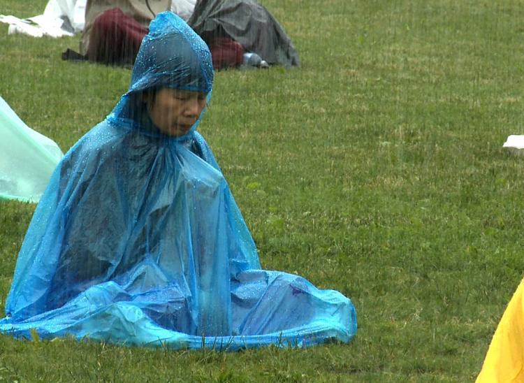 <a><img src="https://www.theepochtimes.com/assets/uploads/2015/09/Lady-Rain.jpg" alt="A Falun Gong practitioner meditates on Parliament Hill in heavy rain on June 24 during Chinese leader Hu Jintao's official visit to Canada before the G20 meetings in Toronto later this week." title="A Falun Gong practitioner meditates on Parliament Hill in heavy rain on June 24 during Chinese leader Hu Jintao's official visit to Canada before the G20 meetings in Toronto later this week." width="320" class="size-medium wp-image-1818132"/></a>