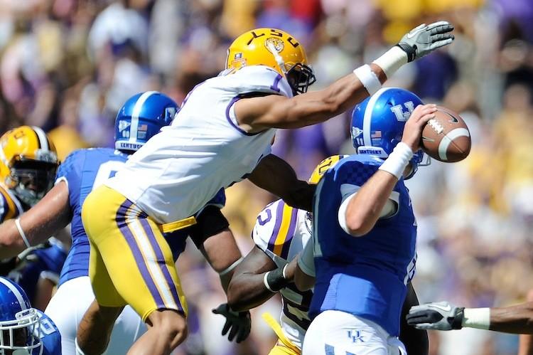 <a><img src="https://www.theepochtimes.com/assets/uploads/2015/09/Mathieu127821395.jpg" alt="LSU cornerback Tyrann Mathieu strips the ball from Kentucky quarterback Maxwell Smith on October 1st. The top-ranked Tigers won 35-7 and are currently 7-0. (Stacy Revere/Getty Images)" title="LSU cornerback Tyrann Mathieu strips the ball from Kentucky quarterback Maxwell Smith on October 1st. The top-ranked Tigers won 35-7 and are currently 7-0. (Stacy Revere/Getty Images)" width="575" class="size-medium wp-image-1796099"/></a>