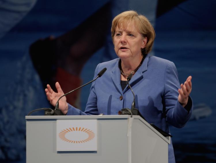 <a><img src="https://www.theepochtimes.com/assets/uploads/2015/09/Merkel_99300642Merkel_99300642." alt="UNDER PRESSURE: German Chancellor Angela Merkel gives a speech on May 14 in Munich. Merkel has become less popular among some Germans for her support of the European currency rescue bill.  (Alexandra Beier/Getty Images)" title="UNDER PRESSURE: German Chancellor Angela Merkel gives a speech on May 14 in Munich. Merkel has become less popular among some Germans for her support of the European currency rescue bill.  (Alexandra Beier/Getty Images)" width="300" class="size-medium wp-image-1819839"/></a>