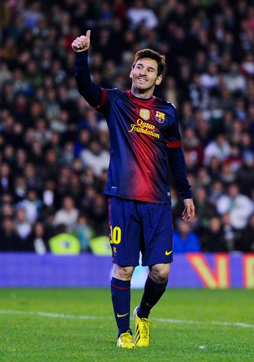 Lionel Messi of FC Barcelona gives his thumbs up during the La Liga match between Real Betis and FC Barcelona at Estadio Benito Villamarin, Dec. 9, 2012 in Seville, Spain. (David Ramos/Getty Images)