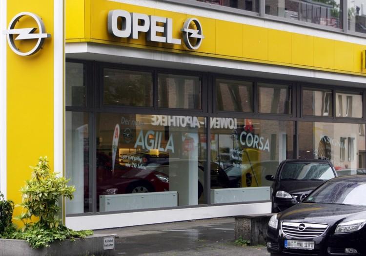 <a><img class="size-large wp-image-1781159" src="https://www.theepochtimes.com/assets/uploads/2015/09/OPEL.jpg" alt="The Opel logo can be seen at an Opel dealership in the western German city of Bochum in this file photo. Opel is in negotiations to close a core plant in Bochum due to sales dropping 18.9 percent compared to last year. (Patrik Stollarz/AFP/Getty Images)" width="590" height="413"/></a>