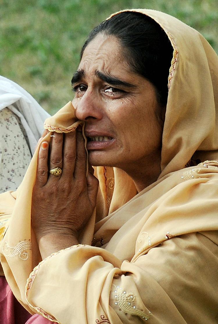 <a><img src="https://www.theepochtimes.com/assets/uploads/2015/09/Pakistan82498086.jpg" alt="A Pakistani woman weeps for her injured relative after the suicide attack as she awaits for permission to visit him at the Pakistan Ordnance Factory hospital in Wah on Aug. 21.      (Farooq Naeem/AFP/Getty Images)" title="A Pakistani woman weeps for her injured relative after the suicide attack as she awaits for permission to visit him at the Pakistan Ordnance Factory hospital in Wah on Aug. 21.      (Farooq Naeem/AFP/Getty Images)" width="320" class="size-medium wp-image-1833965"/></a>