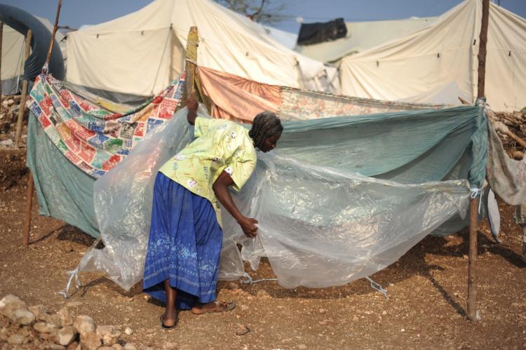 <a><img src="https://www.theepochtimes.com/assets/uploads/2015/09/Photo1-Haitian_Woman.jpg" alt="A Haitian woman sets up her makeshift tent at a camp in Port-au-Prince on March 1. (Eitan Abramovich/AFP/Getty Images)" title="A Haitian woman sets up her makeshift tent at a camp in Port-au-Prince on March 1. (Eitan Abramovich/AFP/Getty Images)" width="320" class="size-medium wp-image-1822013"/></a>
