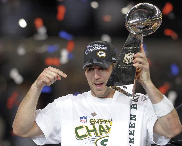 <a><img src="https://www.theepochtimes.com/assets/uploads/2015/09/Rodgers112129612.jpg" alt="Green Bay quarterback Aaron Rodgers points toward the NFL's most coveted trophy as he celebrates the Super Bowl win over Pittsburgh last February. One of the premier signal-callers in the league, Rodgers seems poised to lead his team back to the top in 2011. (Timothy A. Clary/Getty Images)" title="Green Bay quarterback Aaron Rodgers points toward the NFL's most coveted trophy as he celebrates the Super Bowl win over Pittsburgh last February. One of the premier signal-callers in the league, Rodgers seems poised to lead his team back to the top in 2011. (Timothy A. Clary/Getty Images)" width="320" class="size-medium wp-image-1798074"/></a>