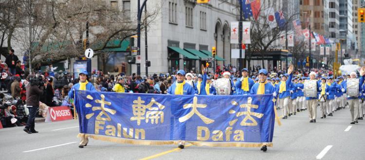 Falun Gong practitioners march in Roger's Santa Clause Parade in downtown Vancouver Dec. 5, 2010. The group says its application to participate in the Chinese New Year Parade has been rejected every year since 2003. (The Epoch Times)