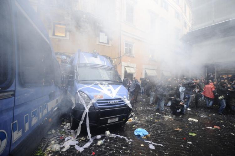 <a><img src="https://www.theepochtimes.com/assets/uploads/2015/09/Rome_violence_107209416.jpg" alt="Rubbish thrown by demostrators lies strewn on police cars during a protest against education reform on November 30, 2010 in Rome. Students and academics are outraged at cuts of around nine billion euros (12 billion dollars) and 130,000 jobs in the education system.  (Filippo Monteforte/AFP/Getty Images)" title="Rubbish thrown by demostrators lies strewn on police cars during a protest against education reform on November 30, 2010 in Rome. Students and academics are outraged at cuts of around nine billion euros (12 billion dollars) and 130,000 jobs in the education system.  (Filippo Monteforte/AFP/Getty Images)" width="320" class="size-medium wp-image-1811422"/></a>