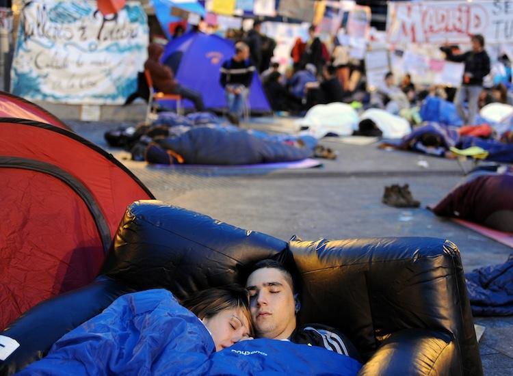 <a><img class="size-medium wp-image-1803732" title="CAMP OUT: Young people camp out at Puerta del Sol plaza in Madrid on voting day in Spain's regional elections on May 22. Despite a ban on political protests ahead of elections, the number of demonstrators, angry with the high youth unemployment and economic policies, gathered in the capital in the tens of thousands. (Jasper Juinen/Getty Images)" src="https://www.theepochtimes.com/assets/uploads/2015/09/SPAIN-SUN-114490674.jpg" alt="CAMP OUT: Young people camp out at Puerta del Sol plaza in Madrid on voting day in Spain's regional elections on May 22. Despite a ban on political protests ahead of elections, the number of demonstrators, angry with the high youth unemployment and economic policies, gathered in the capital in the tens of thousands. (Jasper Juinen/Getty Images)" width="320"/></a>