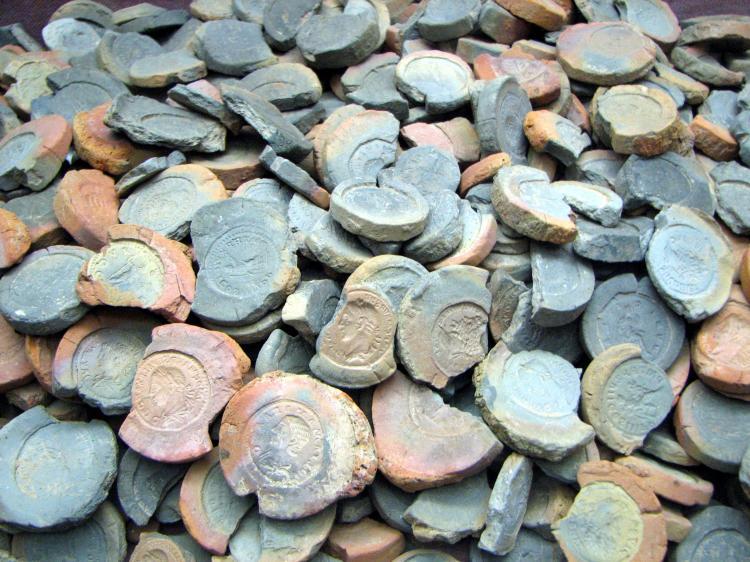 <a><img src="https://www.theepochtimes.com/assets/uploads/2015/09/SciTech_Forms_for_fake_coins.jpg" alt="Forms to cast fake 2nd to 3rd century coins, found in Trier, Germany. The global market for fake artifacts has boomed with the popularity of online auction websites. (Chris 73/Wikimedia Commons licensed under CC-BY-SA 2.5)" title="Forms to cast fake 2nd to 3rd century coins, found in Trier, Germany. The global market for fake artifacts has boomed with the popularity of online auction websites. (Chris 73/Wikimedia Commons licensed under CC-BY-SA 2.5)" width="320" class="size-medium wp-image-1828090"/></a>