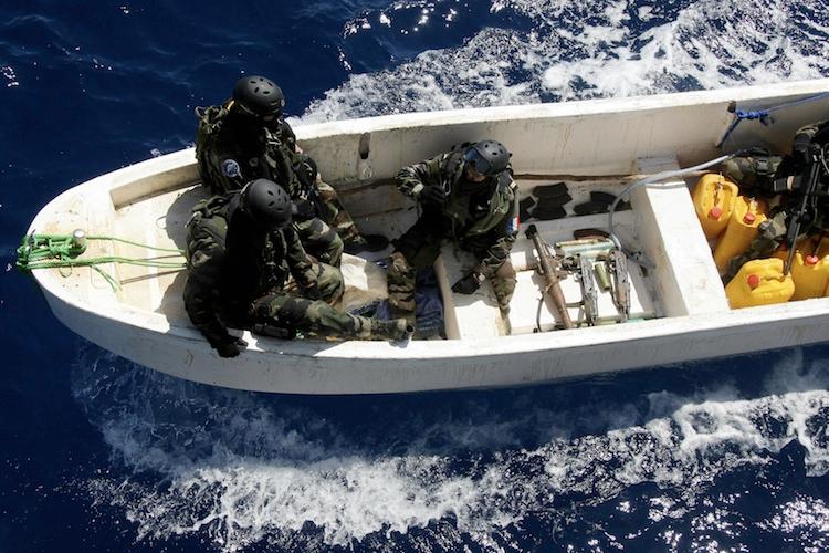 <a><img class="size-large wp-image-1787481" title="French soldiers sit alongside a cache of weapons seized from suspected Somali pirates as they arrive by launch at the French warship 'Le Nivose' on May 3, 2009, as part of EU's Atalante anti-piracy naval mission. (Pierre Verdy/AFP/Getty Images)" src="https://www.theepochtimes.com/assets/uploads/2015/09/Somali86357297.jpg" alt="" width="590" height="393"/></a>
