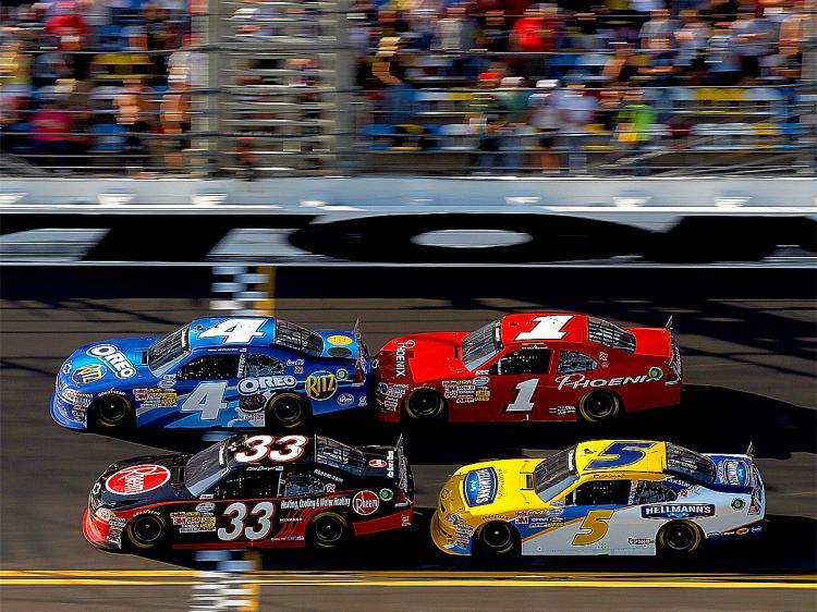 <a><img src="https://www.theepochtimes.com/assets/uploads/2015/09/Stewart109297953Web.jpg" alt="Tony Stewart in the #4 Oreo/Ritz Chevrolet, leads Clint Bowyer in the #33 Rheem Heating, Cooling & Water Heating Chevrolet, Landon Cassill in the #1 Phoenix Construction Chevrolet, and Dale Earnhardt Jr.in the #5 Hellmann's Chevrolet, across the finish line to win the NASCAR Nationwide Series DRIVE4COPD 300 at Daytona International Speedway. (Matthew Stockman/Getty Images for NASCAR)" title="Tony Stewart in the #4 Oreo/Ritz Chevrolet, leads Clint Bowyer in the #33 Rheem Heating, Cooling & Water Heating Chevrolet, Landon Cassill in the #1 Phoenix Construction Chevrolet, and Dale Earnhardt Jr.in the #5 Hellmann's Chevrolet, across the finish line to win the NASCAR Nationwide Series DRIVE4COPD 300 at Daytona International Speedway. (Matthew Stockman/Getty Images for NASCAR)" width="320" class="size-medium wp-image-1808053"/></a>