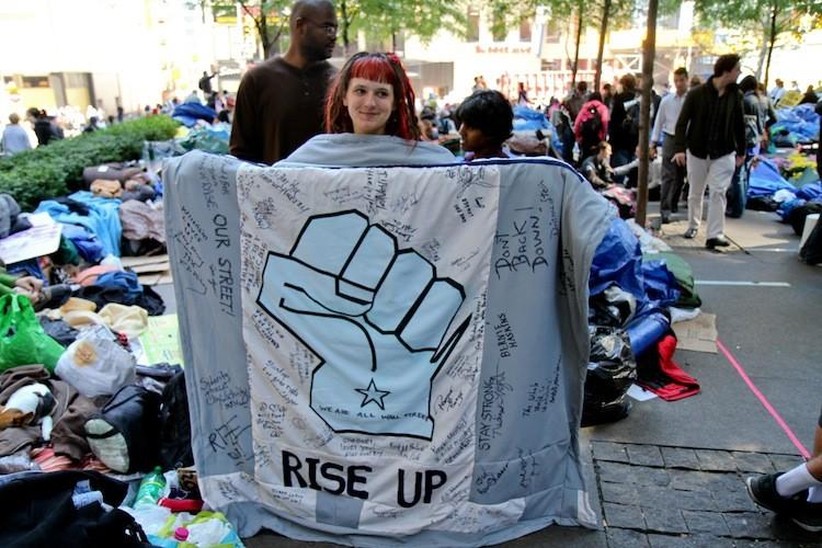 <a><img src="https://www.theepochtimes.com/assets/uploads/2015/09/Stieber_100611_OccupyWalStreet.jpg" alt="Protesters demonstrating on Wall st. on Oct. 9. Mayor Michael Bloomberg called the Wall Street protests unproductive in his weekly radio address. (Zack Stieber/The Epoch Times)" title="Protesters demonstrating on Wall st. on Oct. 9. Mayor Michael Bloomberg called the Wall Street protests unproductive in his weekly radio address. (Zack Stieber/The Epoch Times)" width="320" class="size-medium wp-image-1796665"/></a>