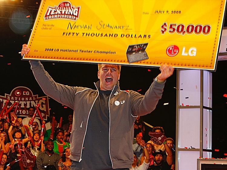 <a><img src="https://www.theepochtimes.com/assets/uploads/2015/09/TEXTING.jpg" alt="FASTEST FINGERS: Nathan Schwartz, 20, of Ohio holds his check for $50,000 after winning the LG National Texting Competition on Wednesday. (Edward Dai/The Epoch Times)" title="FASTEST FINGERS: Nathan Schwartz, 20, of Ohio holds his check for $50,000 after winning the LG National Texting Competition on Wednesday. (Edward Dai/The Epoch Times)" width="320" class="size-medium wp-image-1835010"/></a>