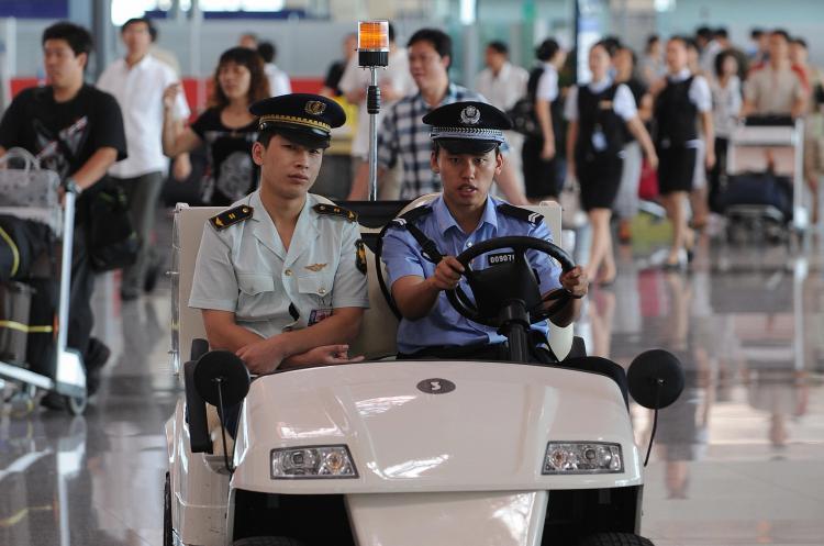 <a><img src="https://www.theepochtimes.com/assets/uploads/2015/09/Taiwan_81934669.jpg" alt="Chinese police patrol the International airport in Beijing.  (Mark Ralston/AFP/Getty Images)" title="Chinese police patrol the International airport in Beijing.  (Mark Ralston/AFP/Getty Images)" width="320" class="size-medium wp-image-1834396"/></a>