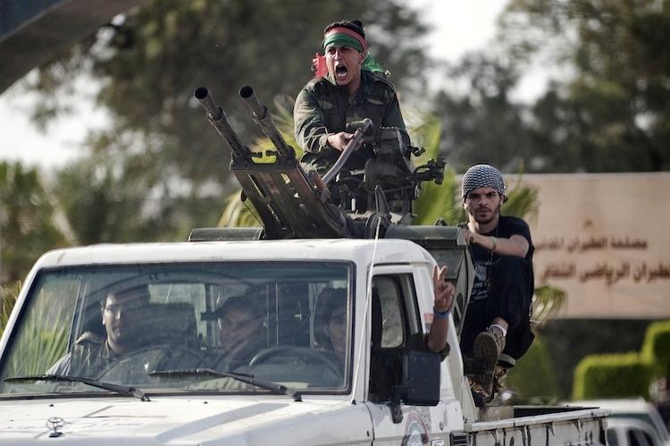 <a><img class="size-large wp-image-1786681" title="Libyan government forces arrive at Tripoli International Airport to join in negotiations with the al-Awfya brigade that overran the airport a few hours earlier on June 4. (GianLuigi Guercia/AFP/Getty Images)" src="https://www.theepochtimes.com/assets/uploads/2015/09/Tripoli145714834.jpg" alt="" width="590" height="392"/></a>