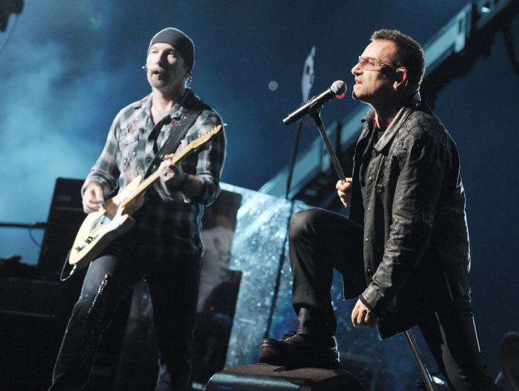 <a><img src="https://www.theepochtimes.com/assets/uploads/2015/09/U2_92340644.jpg" alt="Musician The Edge (L) and singer Bono of U2 perform onstage during their '360 Degrees Tour' at the Rose Bowl on October 25, 2009 in Pasadena, California. U2 will be rescheduling their North American tour, following Bono's recent back surgery. (Kevin Winter/Getty Images)" title="Musician The Edge (L) and singer Bono of U2 perform onstage during their '360 Degrees Tour' at the Rose Bowl on October 25, 2009 in Pasadena, California. U2 will be rescheduling their North American tour, following Bono's recent back surgery. (Kevin Winter/Getty Images)" width="320" class="size-medium wp-image-1819498"/></a>