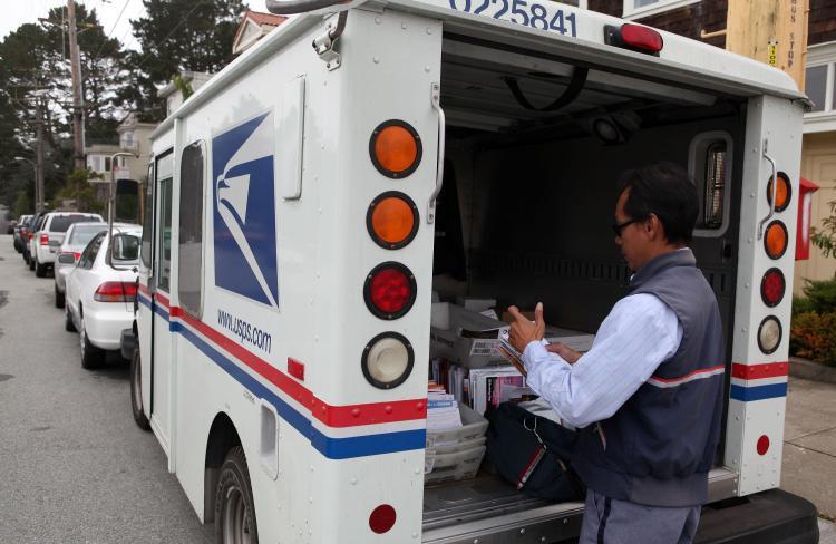 <a><img src="https://www.theepochtimes.com/assets/uploads/2015/09/USPS.jpg" alt="LOSING MONEY: U.S. Postal Service letter carrier Anthony Ow sorts through mail in the back of his delivery truck in San Francisco. The USPS lost $3.5 billion in the latest quarter." title="LOSING MONEY: U.S. Postal Service letter carrier Anthony Ow sorts through mail in the back of his delivery truck in San Francisco. The USPS lost $3.5 billion in the latest quarter." width="320" class="size-medium wp-image-1816245"/></a>
