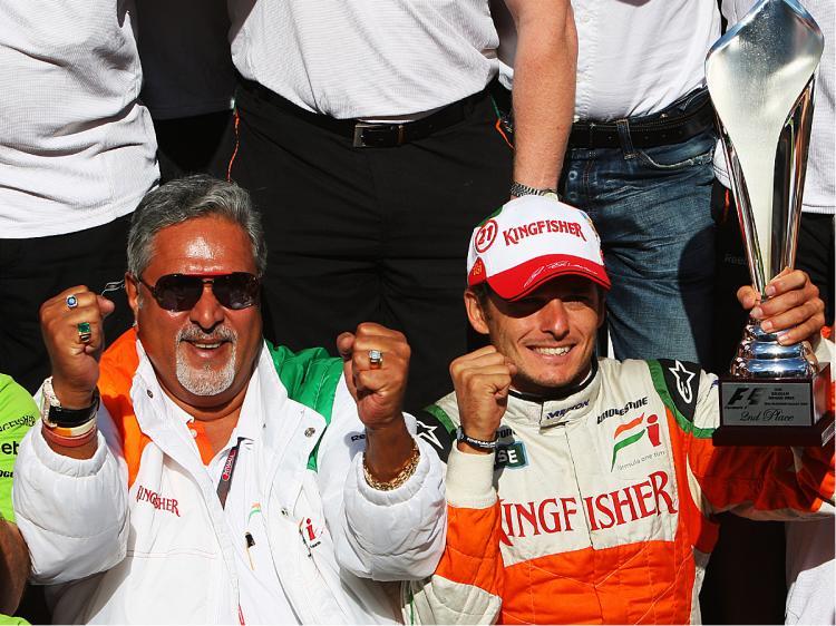<a><img src="https://www.theepochtimes.com/assets/uploads/2015/09/VJAT90185881.jpg" alt="Giancarlo Fisichella and Force India team owner Dr Vijay Mallya celebrate Fisischella's second-place finish in the Belgian Grand Prix, August 30, 2009. (Mark Thompson/Getty Images)" title="Giancarlo Fisichella and Force India team owner Dr Vijay Mallya celebrate Fisischella's second-place finish in the Belgian Grand Prix, August 30, 2009. (Mark Thompson/Getty Images)" width="320" class="size-medium wp-image-1826438"/></a>