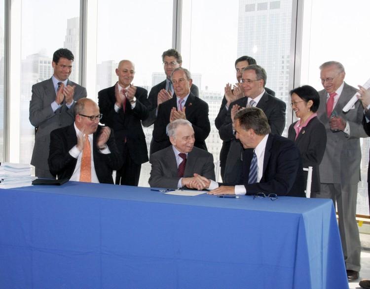 <a><img src="https://www.theepochtimes.com/assets/uploads/2015/09/WTCcondenast.jpg" alt="Chairman of Conde' Nast Publisher S.I. Newhouse (C, seated at table) signed a 25-year lease for 1 million square feet of office space at One World Trade Center on Wednesday at the building's construction site. Also seated are Port Authority of New York and and New Jersey Chairman David Samson (R) and PANYNJ Executive Director Chris Ward (L). In the second row are Mayor Bloomberg (C), Borough of Manhattan President Scott Stringer (2nd from R), and Councilwoman Margaret Chin (R). (Lixin Shi/The Epoch Times)" title="Chairman of Conde' Nast Publisher S.I. Newhouse (C, seated at table) signed a 25-year lease for 1 million square feet of office space at One World Trade Center on Wednesday at the building's construction site. Also seated are Port Authority of New York and and New Jersey Chairman David Samson (R) and PANYNJ Executive Director Chris Ward (L). In the second row are Mayor Bloomberg (C), Borough of Manhattan President Scott Stringer (2nd from R), and Councilwoman Margaret Chin (R). (Lixin Shi/The Epoch Times)" width="320" class="size-medium wp-image-1803565"/></a>