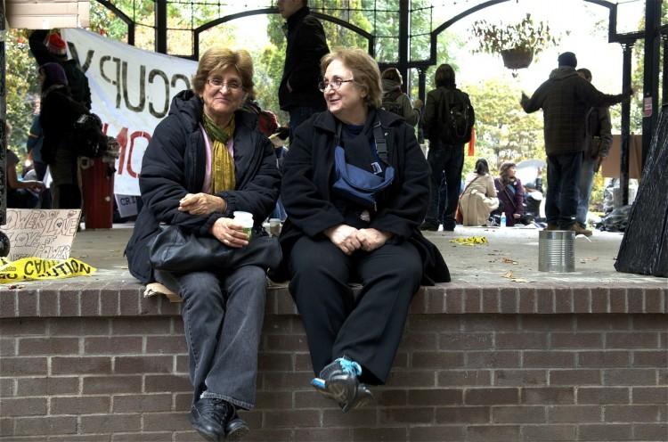 <a><img src="https://www.theepochtimes.com/assets/uploads/2015/09/Women.jpg" alt="Two women sit on the gazebo at the Occupy Bay Street protest site in St. James Park, Toronto.  (Matthew Little/The Epoch Times)" title="Two women sit on the gazebo at the Occupy Bay Street protest site in St. James Park, Toronto.  (Matthew Little/The Epoch Times)" width="350" class="size-medium wp-image-1796078"/></a>