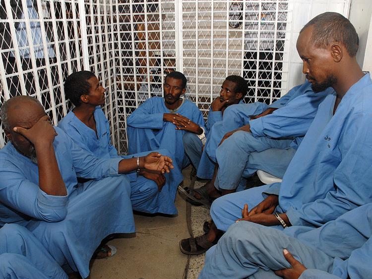 <a><img src="https://www.theepochtimes.com/assets/uploads/2015/09/Yemen91234497.jpg" alt="Suspected Somali pirates sit in a cell at the Yemeni state security court in Sanaa on September 29, 2009, during the first hearing in their trial. (Khaled Fazaa/AFP/Getty Images)" title="Suspected Somali pirates sit in a cell at the Yemeni state security court in Sanaa on September 29, 2009, during the first hearing in their trial. (Khaled Fazaa/AFP/Getty Images)" width="320" class="size-medium wp-image-1819709"/></a>