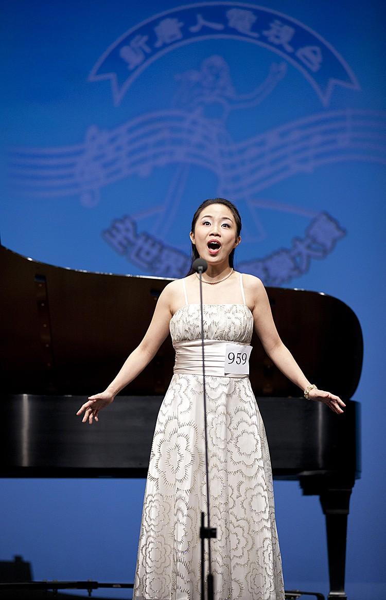 <a><img src="https://www.theepochtimes.com/assets/uploads/2015/09/_MG_8529.jpg" alt="LAST YEAR: Soprano Tan Sinsim sings at 2010 NTDTV Chinese International Vocal Competition semifinal. She received the $10,000 gold award in the competition's female division. (Edward Dai/The Epoch Times)" title="LAST YEAR: Soprano Tan Sinsim sings at 2010 NTDTV Chinese International Vocal Competition semifinal. She received the $10,000 gold award in the competition's female division. (Edward Dai/The Epoch Times)" width="320" class="size-medium wp-image-1798295"/></a>