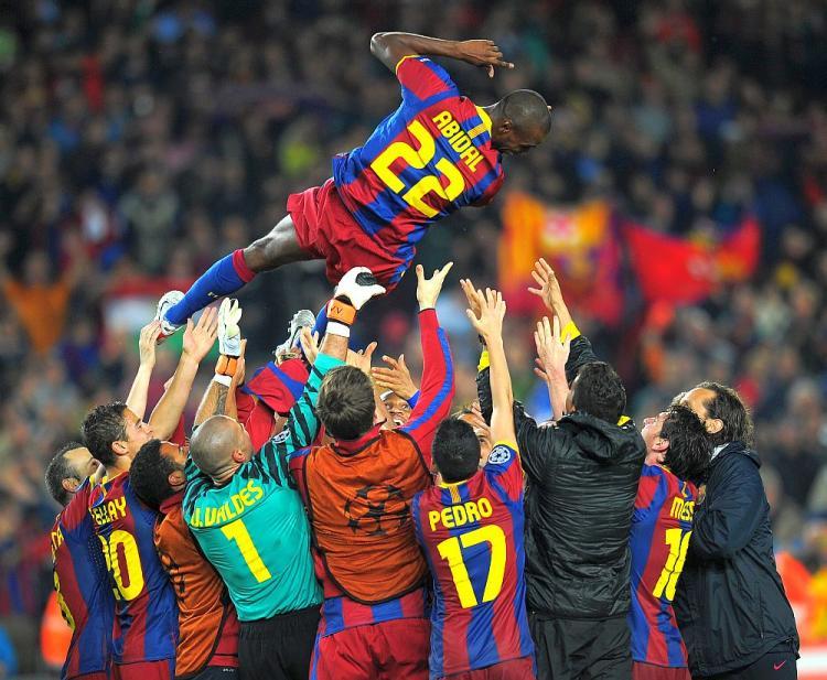 <a><img src="https://www.theepochtimes.com/assets/uploads/2015/09/abidal113586588.jpg" alt="Barcelona players celebrate the return of their teammate Eric Abidal in Tuesday's Champions League match against Real Madrid. (Lluis Gene/AFP/Getty Images)" title="Barcelona players celebrate the return of their teammate Eric Abidal in Tuesday's Champions League match against Real Madrid. (Lluis Gene/AFP/Getty Images)" width="320" class="size-medium wp-image-1804547"/></a>