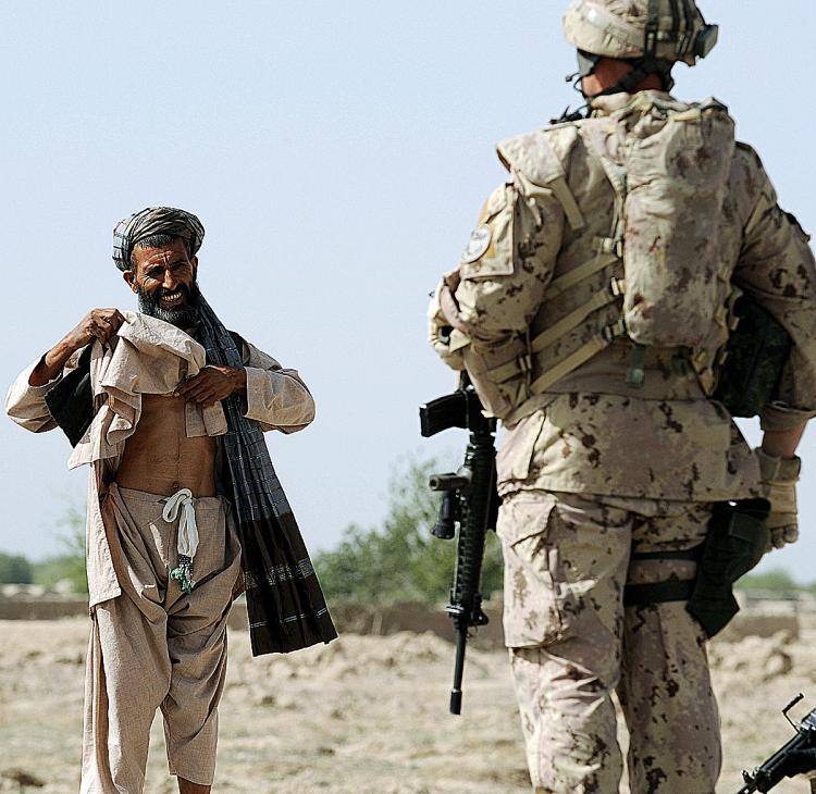 <a><img src="https://www.theepochtimes.com/assets/uploads/2015/09/afagaf80413944.jpg" alt="A Canadian soldier with the NATO-led International Security Assistance Force (ISAF) stops an Afghan passer-by during a patrol in Panjwayi district, some 30 kms west of Kandahar province earlier this year. The deaths of two children have brought Canadian s (Shah Marai/AFP/Getty Images)" title="A Canadian soldier with the NATO-led International Security Assistance Force (ISAF) stops an Afghan passer-by during a patrol in Panjwayi district, some 30 kms west of Kandahar province earlier this year. The deaths of two children have brought Canadian s (Shah Marai/AFP/Getty Images)" width="320" class="size-medium wp-image-1834647"/></a>