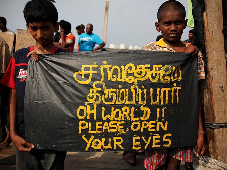 <a><img src="https://www.theepochtimes.com/assets/uploads/2015/09/assyyl92421031.jpg" alt="Sri Lankan asylum seekers hold placards during a protest on board a wooden boat demanding the United Nations High Commission for Refugees (UNHCR) to take care of a group of refugees, at Merak seaport on October 28, 2009 in Banten Province, Indonesia. (Ulet Ifansasti/Getty Images)" title="Sri Lankan asylum seekers hold placards during a protest on board a wooden boat demanding the United Nations High Commission for Refugees (UNHCR) to take care of a group of refugees, at Merak seaport on October 28, 2009 in Banten Province, Indonesia. (Ulet Ifansasti/Getty Images)" width="320" class="size-medium wp-image-1821129"/></a>
