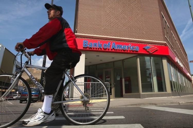 <a><img src="https://www.theepochtimes.com/assets/uploads/2015/09/bac_124747378.jpg" alt="A cyclist rides past a Bank of America branch on Sept. 12 in Chicago. Bank of America was recently downgraded by Moody's Investors Service and faces numerous legal troubles.  (Scott Olson/Getty Images)" title="A cyclist rides past a Bank of America branch on Sept. 12 in Chicago. Bank of America was recently downgraded by Moody's Investors Service and faces numerous legal troubles.  (Scott Olson/Getty Images)" width="575" class="size-medium wp-image-1796872"/></a>