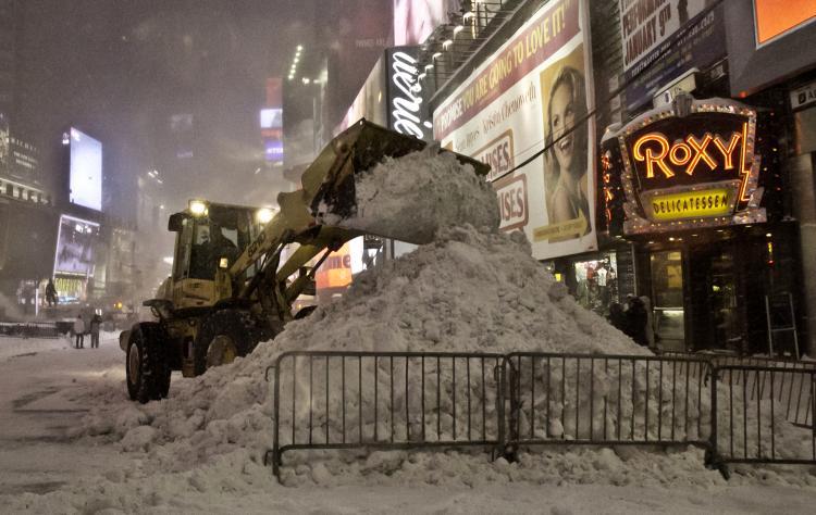<a><img src="https://www.theepochtimes.com/assets/uploads/2015/09/blizzard1.jpg" alt="BLIZZARD OF 2010: Snow is cleared at Times Squares on Dec. 26, during the historic blizzard that dropped two feet of snow on New York City.  (Phoebe Zheng/The Epoch Times)" title="BLIZZARD OF 2010: Snow is cleared at Times Squares on Dec. 26, during the historic blizzard that dropped two feet of snow on New York City.  (Phoebe Zheng/The Epoch Times)" width="320" class="size-medium wp-image-1810031"/></a>