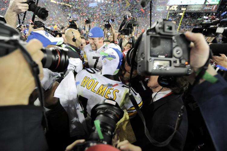<a><img src="https://www.theepochtimes.com/assets/uploads/2015/09/bowl84582608.jpg" alt="Quarterback Ben Roethlisberger of the Pittsburgh Steelers is surrounded by the media following their victory over the Arizona Cardinals in Super Bowl XLIII. (Timothy A. Clary/AFP/Getty Images)" title="Quarterback Ben Roethlisberger of the Pittsburgh Steelers is surrounded by the media following their victory over the Arizona Cardinals in Super Bowl XLIII. (Timothy A. Clary/AFP/Getty Images)" width="320" class="size-medium wp-image-1830801"/></a>