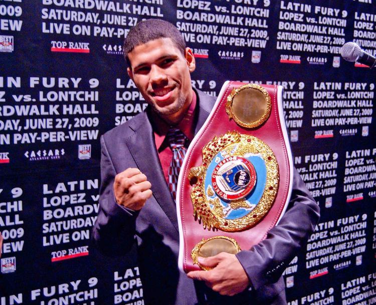 <a><img src="https://www.theepochtimes.com/assets/uploads/2015/09/boxing.jpg" alt="CONTESTED: Juan Manuel â��Juanmaâ�� Lopez holds his junior featherweight champion belt.  (Joshua Philipp/The Epoch Times)" title="CONTESTED: Juan Manuel â��Juanmaâ�� Lopez holds his junior featherweight champion belt.  (Joshua Philipp/The Epoch Times)" width="320" class="size-medium wp-image-1827725"/></a>