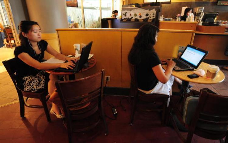 <a><img src="https://www.theepochtimes.com/assets/uploads/2015/09/chcy88875436.jpg" alt="Women use their laptop computers at a wireless cafe in Beijing.  (Frederic J. Brown/AFP/Getty Images)" title="Women use their laptop computers at a wireless cafe in Beijing.  (Frederic J. Brown/AFP/Getty Images)" width="320" class="size-medium wp-image-1817376"/></a>