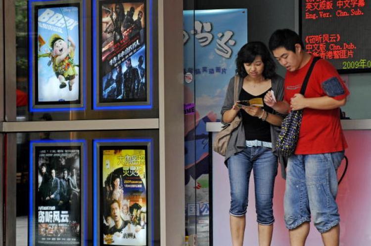 <a><img src="https://www.theepochtimes.com/assets/uploads/2015/09/china_movie_tickets.jpg" alt="A man and a woman check their movie tickets in Shanghai. Movie ticket prices have skyrocketed in China, and now a ticket costs as much as 5 percent of per capita monthly income. (Philippe Lopez/AFP/Getty Images)" title="A man and a woman check their movie tickets in Shanghai. Movie ticket prices have skyrocketed in China, and now a ticket costs as much as 5 percent of per capita monthly income. (Philippe Lopez/AFP/Getty Images)" width="320" class="size-medium wp-image-1815249"/></a>