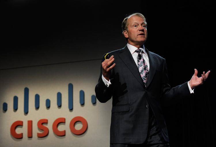 <a><img src="https://www.theepochtimes.com/assets/uploads/2015/09/cisco_95612425.jpg" alt="Cisco Systems chairman and CEO John Chambers speaks during a press event at the 2010 International Consumer Electronics Show Jan 6, 2010 in Las Vegas, Nevada. Cisco announced the CRS-3, a carrier-grade router capable of handling 322 Tbps of data traffic. (Ethan Miller/Getty Images)" title="Cisco Systems chairman and CEO John Chambers speaks during a press event at the 2010 International Consumer Electronics Show Jan 6, 2010 in Las Vegas, Nevada. Cisco announced the CRS-3, a carrier-grade router capable of handling 322 Tbps of data traffic. (Ethan Miller/Getty Images)" width="320" class="size-medium wp-image-1822256"/></a>