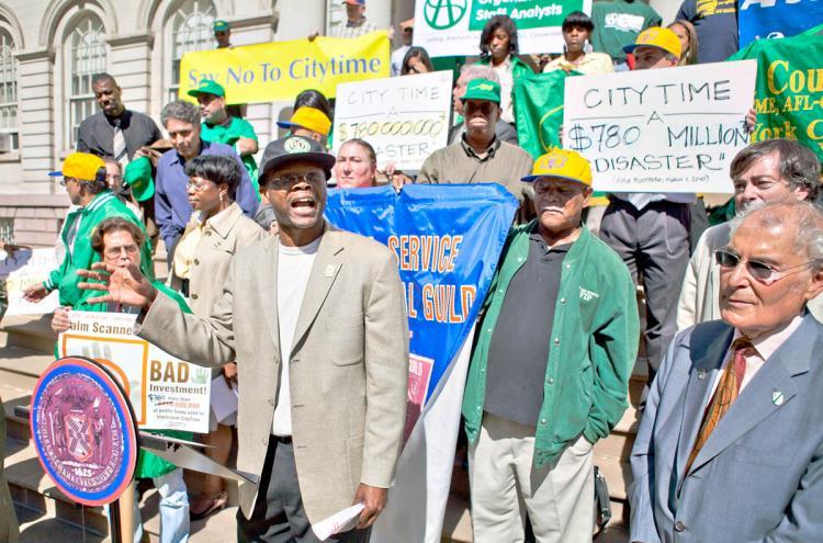 <a><img src="https://www.theepochtimes.com/assets/uploads/2015/09/citytime+WEB.jpg" alt="CITY TIME: Union worker Kyle Simmons from Local 924 protested the city's outsourcing of city payroll software to a private contractor on Tuesday at the steps of City Hall in New York City. (The Epoch Times)" title="CITY TIME: Union worker Kyle Simmons from Local 924 protested the city's outsourcing of city payroll software to a private contractor on Tuesday at the steps of City Hall in New York City. (The Epoch Times)" width="320" class="size-medium wp-image-1814365"/></a>