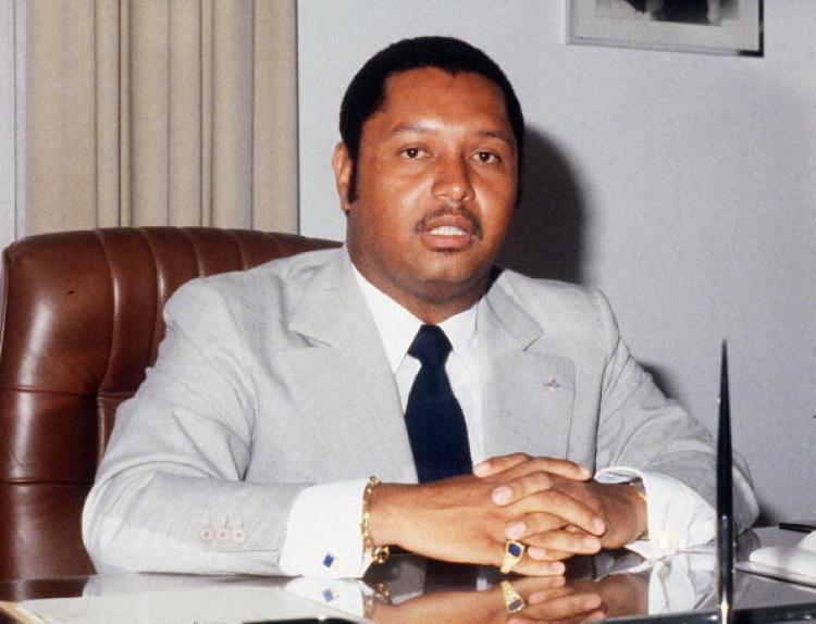 <a><img src="https://www.theepochtimes.com/assets/uploads/2015/09/cr74373431.jpg" alt="A file photo dated March 1982 shows Haiti 's former president Jean-Claude Duvalier, sitting in his office at the presidential palace. Money found in Swiss bank accounts of the former dictator will go to aid agencies.  (Giovanni Coruzzi/AFP/Getty Images)" title="A file photo dated March 1982 shows Haiti 's former president Jean-Claude Duvalier, sitting in his office at the presidential palace. Money found in Swiss bank accounts of the former dictator will go to aid agencies.  (Giovanni Coruzzi/AFP/Getty Images)" width="320" class="size-medium wp-image-1820526"/></a>