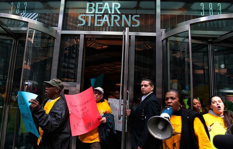 <a><img src="https://www.theepochtimes.com/assets/uploads/2015/09/ebarata80389484.jpg" alt="Demonstrators leave Bear Stearns headquarters March 26, 2008 in New York after protesting the government-backed sale and bailout of the investment bank.  (Chris Hondros/Getty Images)" title="Demonstrators leave Bear Stearns headquarters March 26, 2008 in New York after protesting the government-backed sale and bailout of the investment bank.  (Chris Hondros/Getty Images)" width="320" class="size-medium wp-image-1833936"/></a>