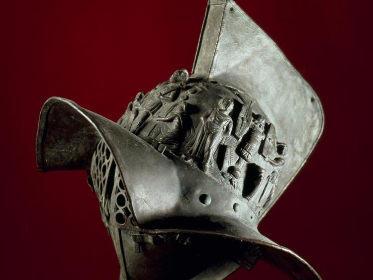 <a><img src="https://www.theepochtimes.com/assets/uploads/2015/09/editedhelmet.JPG" alt="Gladiator's helmet: This helmet was : worn at Pompeii's amphitheatre by a heavily armoured gladiator called a murmillo. Missing from the crest is the splendid plume of feathers or horsehair. (Alfredo and Pio Foglia)" title="Gladiator's helmet: This helmet was : worn at Pompeii's amphitheatre by a heavily armoured gladiator called a murmillo. Missing from the crest is the splendid plume of feathers or horsehair. (Alfredo and Pio Foglia)" width="320" class="size-medium wp-image-1826164"/></a>