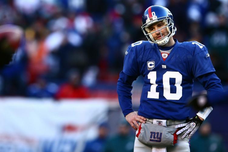<a><img src="https://www.theepochtimes.com/assets/uploads/2015/09/eli.jpg" alt="DISAPPOINTMENT: Eli Manning had a rough day, throwing two interceptions, one of which was returned to the Giants goal line setting up an Eagles score.  (Chris McGrath/Getty Images)" title="DISAPPOINTMENT: Eli Manning had a rough day, throwing two interceptions, one of which was returned to the Giants goal line setting up an Eagles score.  (Chris McGrath/Getty Images)" width="320" class="size-medium wp-image-1831422"/></a>
