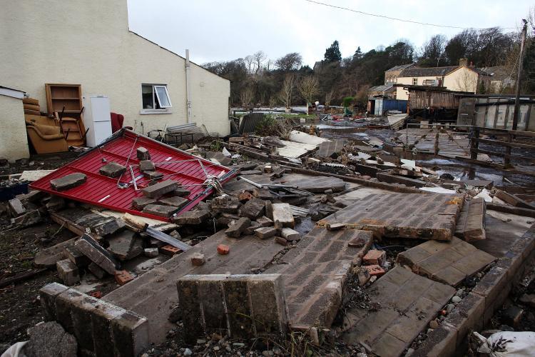 <a><img src="https://www.theepochtimes.com/assets/uploads/2015/09/eng93392311.jpg" alt="Debris litters the garden of a home in the wake of last weeks devastating floods in Cumbria on November 25, 2009 in Cockermouth, England.  (Christopher Furlong/Getty Images)" title="Debris litters the garden of a home in the wake of last weeks devastating floods in Cumbria on November 25, 2009 in Cockermouth, England.  (Christopher Furlong/Getty Images)" width="320" class="size-medium wp-image-1824939"/></a>