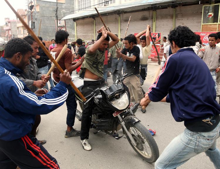 <a><img src="https://www.theepochtimes.com/assets/uploads/2015/09/et98878304.jpg" alt="Unified Communist Party of Nepal (Maoist) supporters hit a local man (C) sitting on a motorcycle with sticks during the fifth day of indefinite strike in Budanilkantha on the outskirts of Kathmandu on May 6, 2010. (Parakash Mathema/AFP/Getty Images)" title="Unified Communist Party of Nepal (Maoist) supporters hit a local man (C) sitting on a motorcycle with sticks during the fifth day of indefinite strike in Budanilkantha on the outskirts of Kathmandu on May 6, 2010. (Parakash Mathema/AFP/Getty Images)" width="320" class="size-medium wp-image-1820214"/></a>