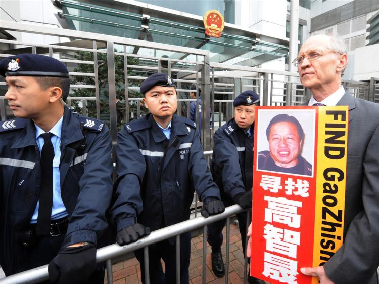 <a><img src="https://www.theepochtimes.com/assets/uploads/2015/09/gao-96401888.jpg" alt="Solicitor John Clancey (R), a member of a lawyers concern group protests for the release of Beijing human rights lawyer Gao Zhisheng outside the China Liaison office in Hong Kong on February 4, 2010. Gao was taken from his home on February 4, 2009 and his whereabouts are still unkown. (Mike Clarke/AFP/Getty Images)" title="Solicitor John Clancey (R), a member of a lawyers concern group protests for the release of Beijing human rights lawyer Gao Zhisheng outside the China Liaison office in Hong Kong on February 4, 2010. Gao was taken from his home on February 4, 2009 and his whereabouts are still unkown. (Mike Clarke/AFP/Getty Images)" width="320" class="size-medium wp-image-1821279"/></a>