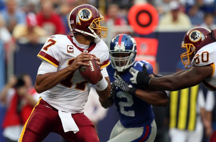 <a><img src="https://www.theepochtimes.com/assets/uploads/2015/09/giantsskins.jpg" alt="New York's defense must do its best to contain quarterback Jason Campbell and the rest of the Washington Redskins' offense. ( Jim McIsaac/Getty Images)" title="New York's defense must do its best to contain quarterback Jason Campbell and the rest of the Washington Redskins' offense. ( Jim McIsaac/Getty Images)" width="320" class="size-medium wp-image-1824639"/></a>